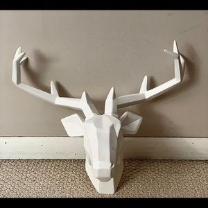 Wall mount deer sculpture.
